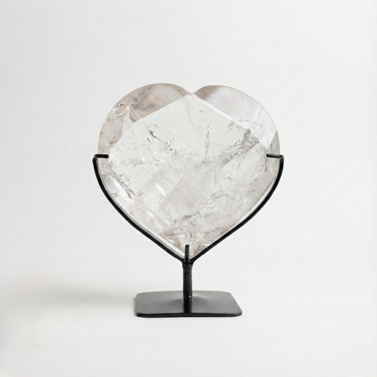 Hyaline Quartz Crystal Faceted Heart on Black Metal Base 1.679 kg