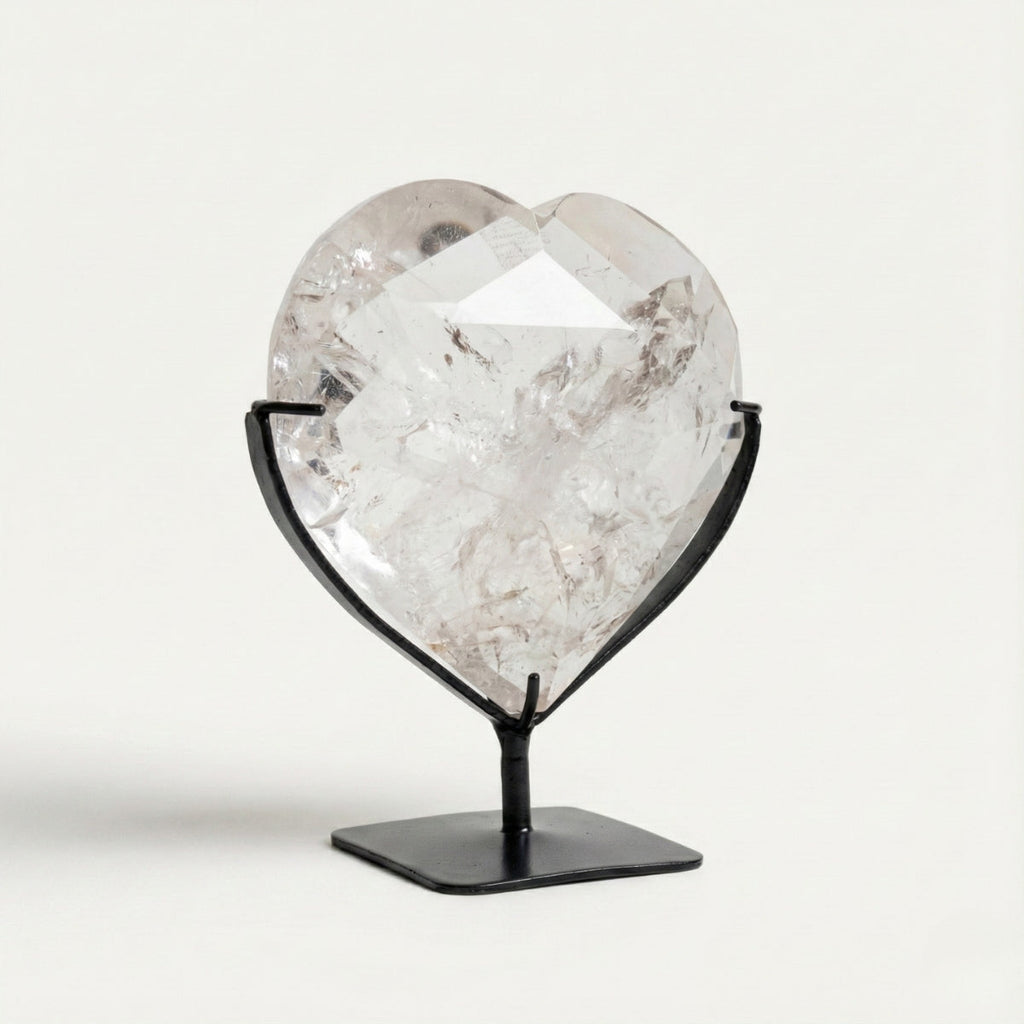 Hyaline Quartz Crystal Faceted Heart on Black Metal Base 820 grams