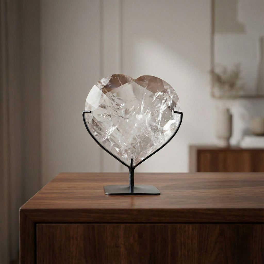 Hyaline Quartz Crystal Faceted Heart on Black Metal Base 820 grams