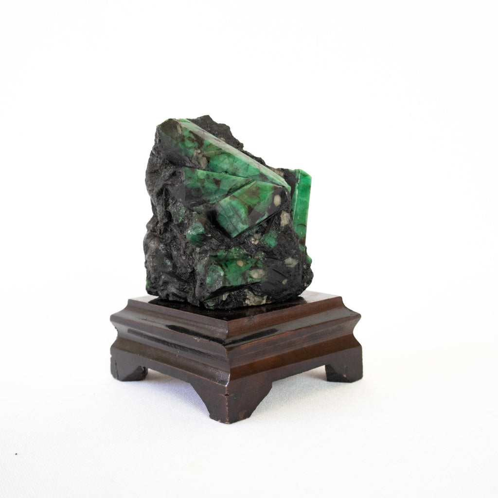Extra Semi-Polished Emerald Stone in Matrix Wood Base 620 grams