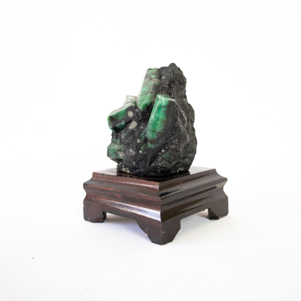 Extra Semi-Polished Emerald Stone in Matrix Wood Base 620 grams